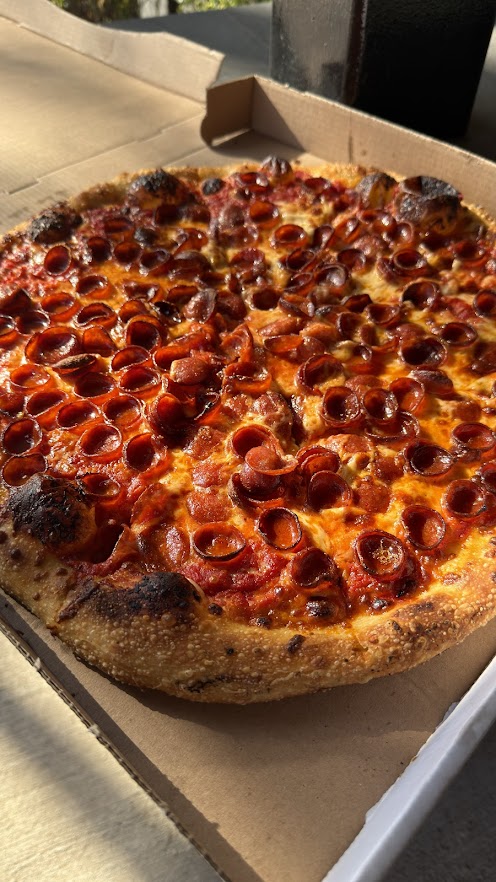 Wood-fired pepperoni pizza in box